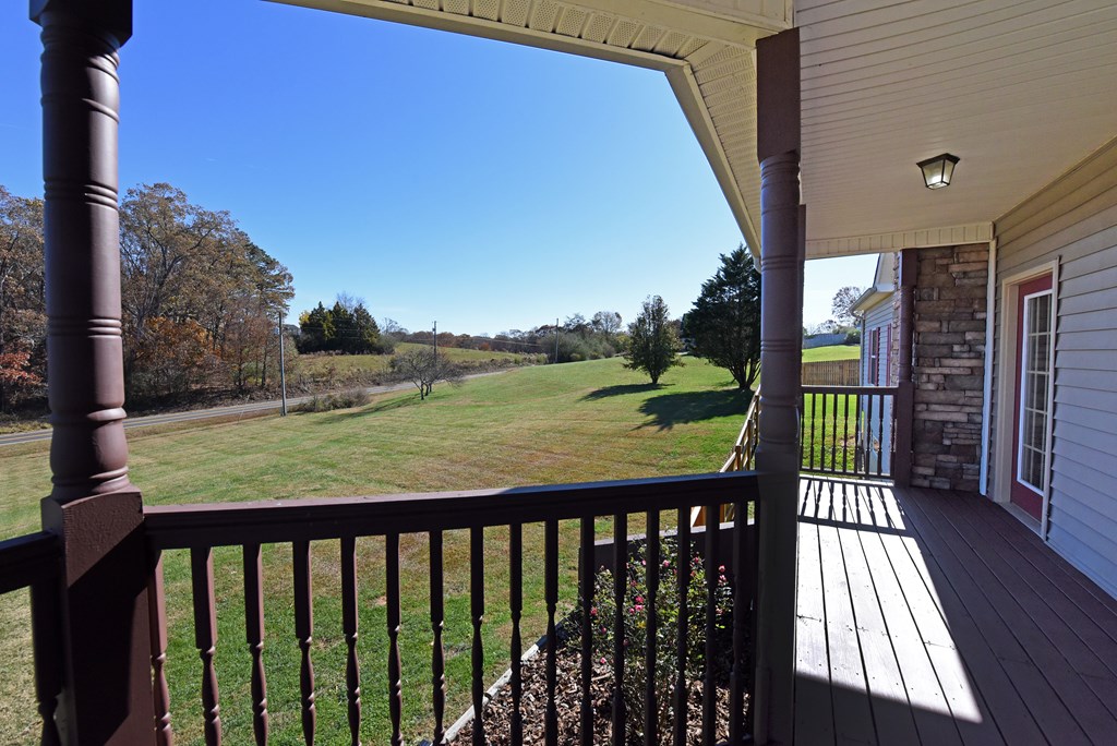 328 Asa Dorsey Road Cleveland, GA 30528 - Photo 11 of 35 a balcony with wooden floor and outdoor space