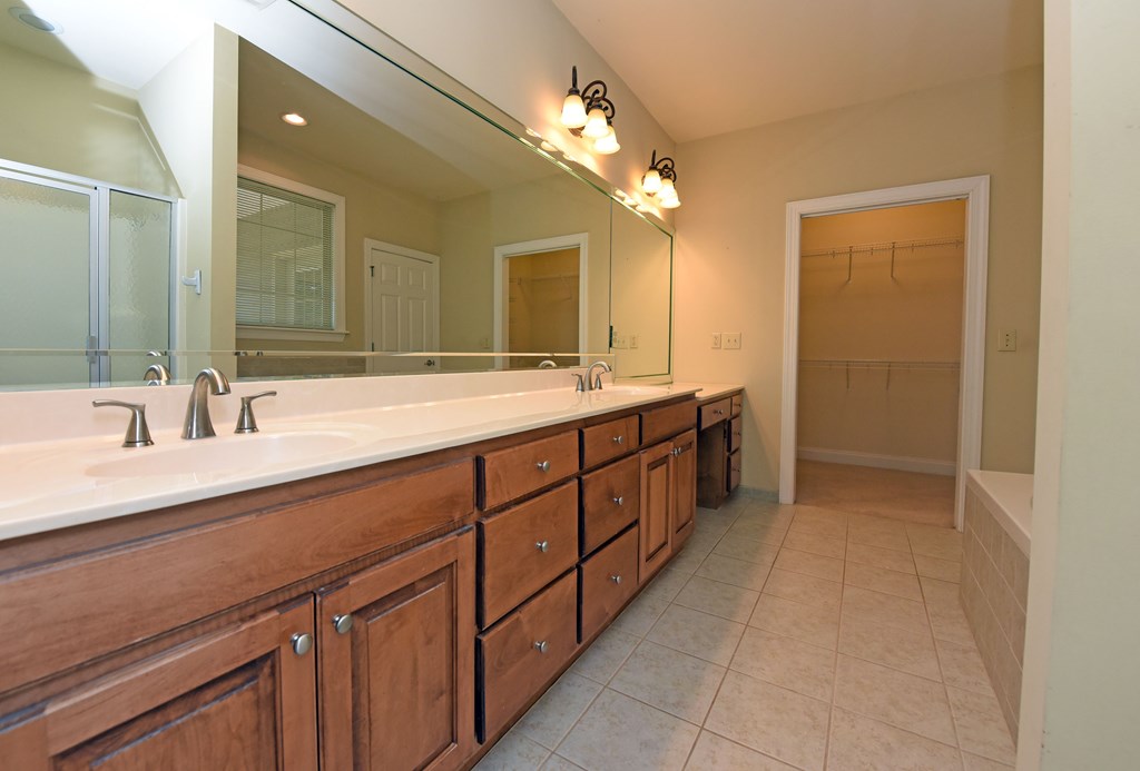 328 Asa Dorsey Road Cleveland, GA 30528 - Photo 14 of 35 a spacious bathroom with a double vanity sink and a mirror