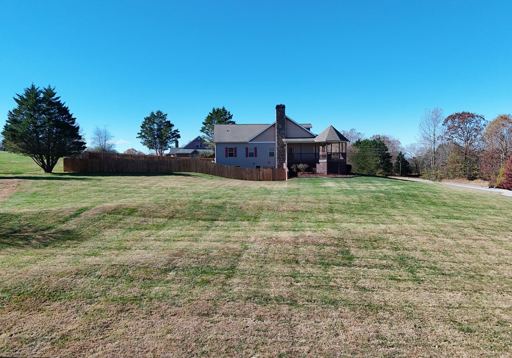 328 Asa Dorsey Road Cleveland, GA 30528 - Photo 16 of 35 a front view of a house with a yard and garage