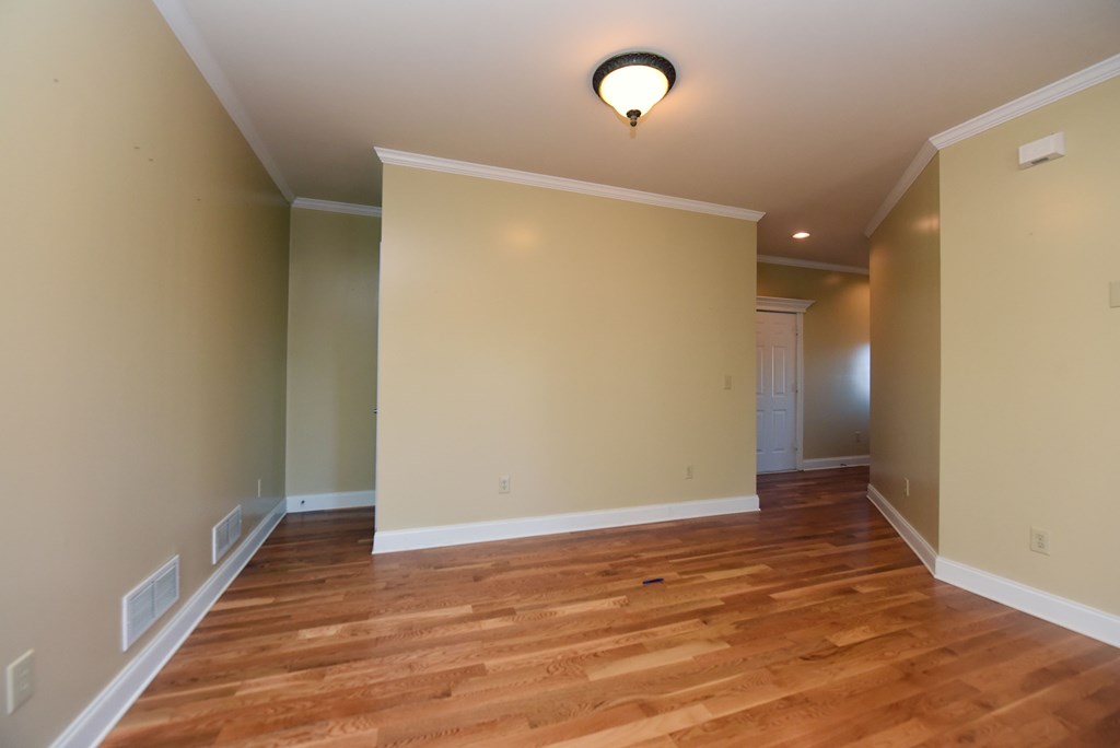 328 Asa Dorsey Road Cleveland, GA 30528 - Photo 19 of 35 an empty room with wooden floor and windows