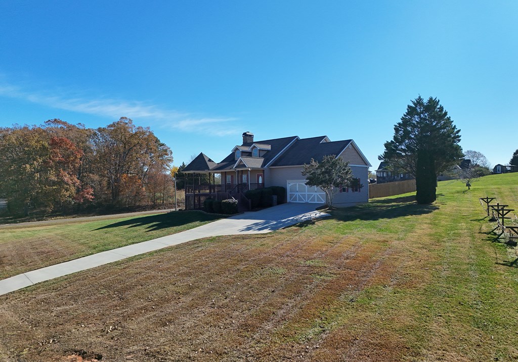 328 Asa Dorsey Road Cleveland, GA 30528 - Photo 26 of 35 a view of a big house with a big yard and large tree