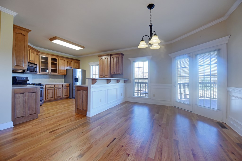 328 Asa Dorsey Road Cleveland, GA 30528 - Photo 4 of 35 a view of a kitchen with furniture wooden floor and a window