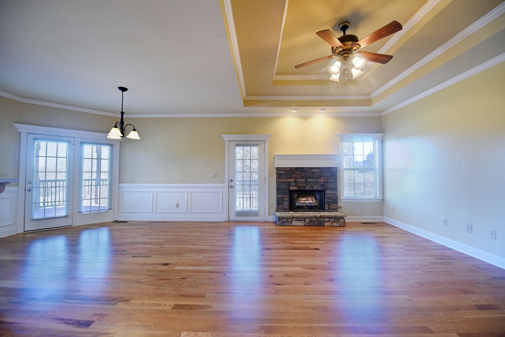 328 Asa Dorsey Road Cleveland, GA 30528 - Photo 8 of 35 a view of an empty room with wooden floor fireplace and a window