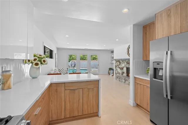 a bedroom with bed and a potted plant