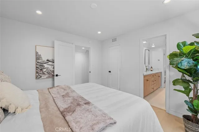 a spacious bathroom with a double vanity sink mirror and