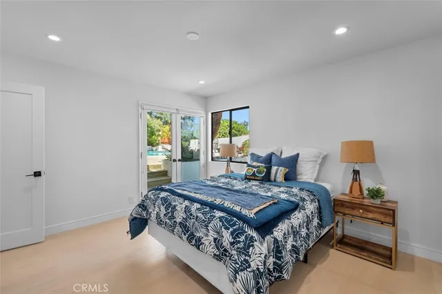 a bedroom with a bed and a couch