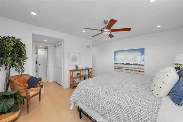 a bathroom with a granite countertop sink a toilet and a mirror