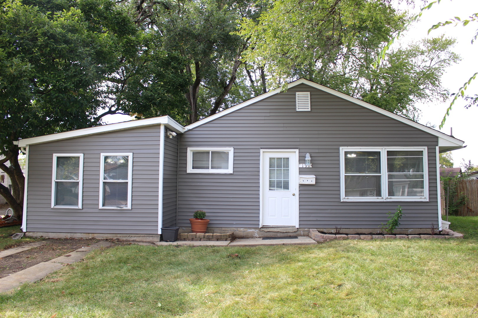 1914 Inner Cir Drive Crest Hill, IL 60403 - Photo 1 of 26 a backyard of a house