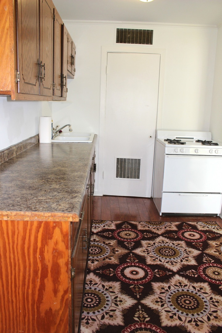 1914 Inner Cir Drive Crest Hill, IL 60403 - Photo 18 of 26 a bathroom with a granite countertop sink and a mirror