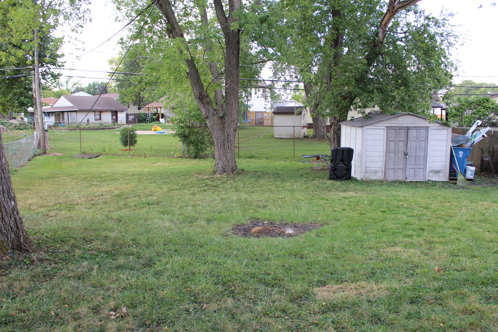 1914 Inner Cir Drive Crest Hill, IL 60403 - Photo 25 of 26 a backyard of a house with table and chairs