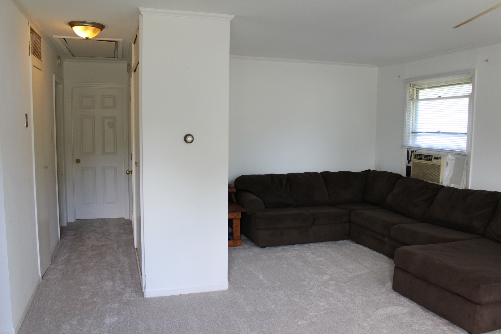 1914 Inner Cir Drive Crest Hill, IL 60403 - Photo 10 of 26 a living room with a couch and a window