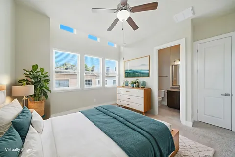 a view of hallway with stairs and wooden floor