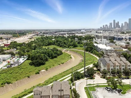 an aerial view of residential building and lake