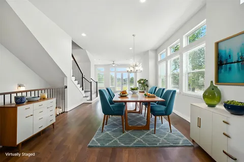 a view of a dining room with furniture window and wooden floor