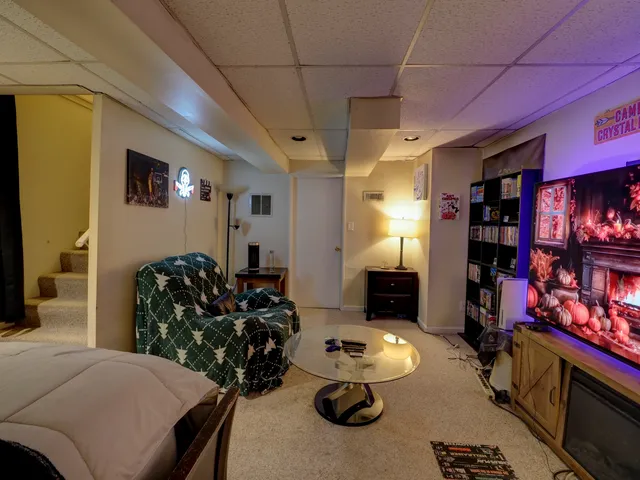 a living room with furniture and a fireplace