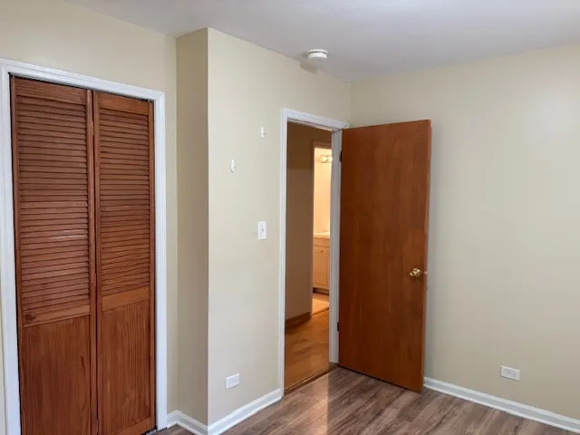 a view of hallway with wooden floor