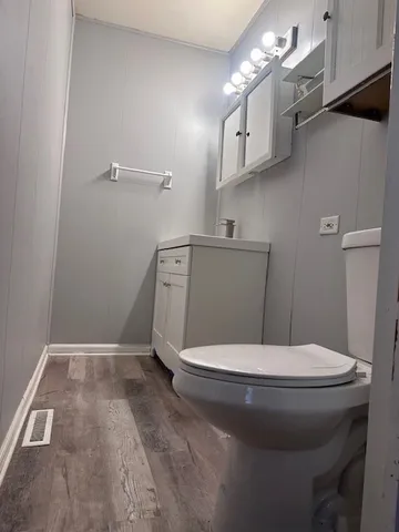a bathroom with a toilet and a sink