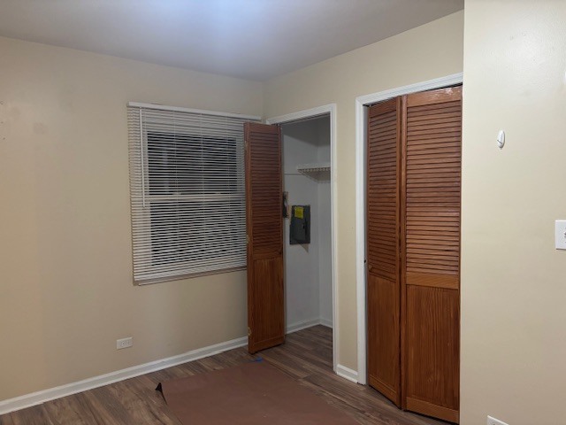 1316 Monroe Street Lake In The Hills, IL 60156 - Photo 15 of 20 a view of an empty room with wooden floor and a window