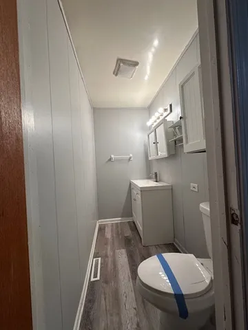 a bathroom with a sink and toilet