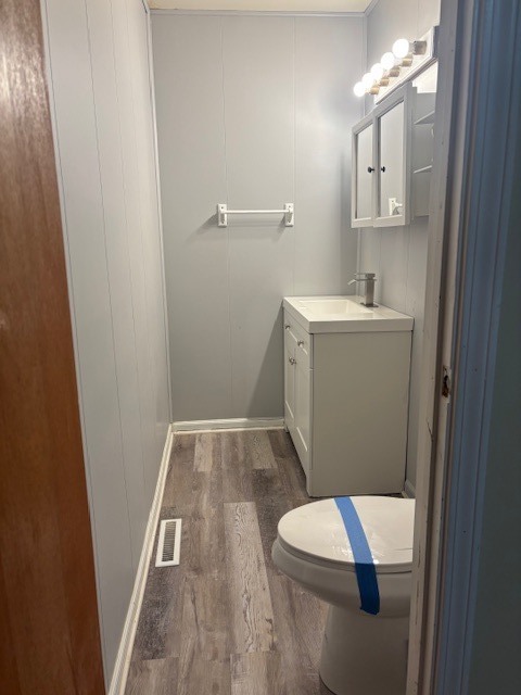 1316 Monroe Street Lake In The Hills, IL 60156 - Photo 19 of 20 a bathroom with a toilet sink and mirror