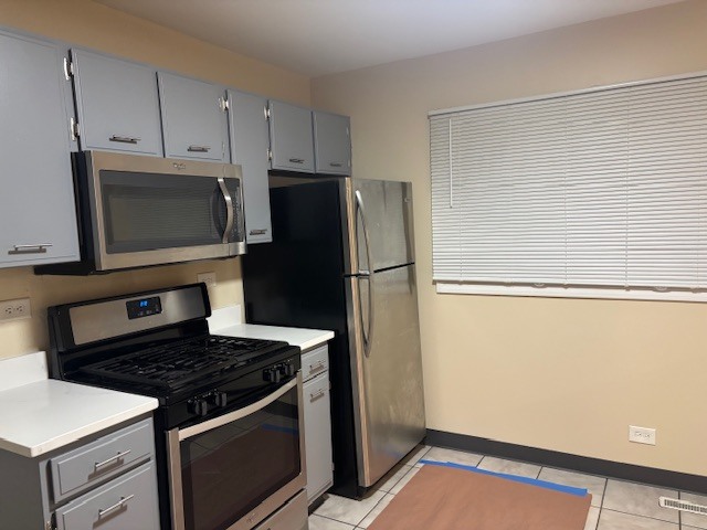 1316 Monroe Street Lake In The Hills, IL 60156 - Photo 5 of 20 a kitchen with appliances and cabinets