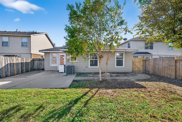 a house view with a backyard space