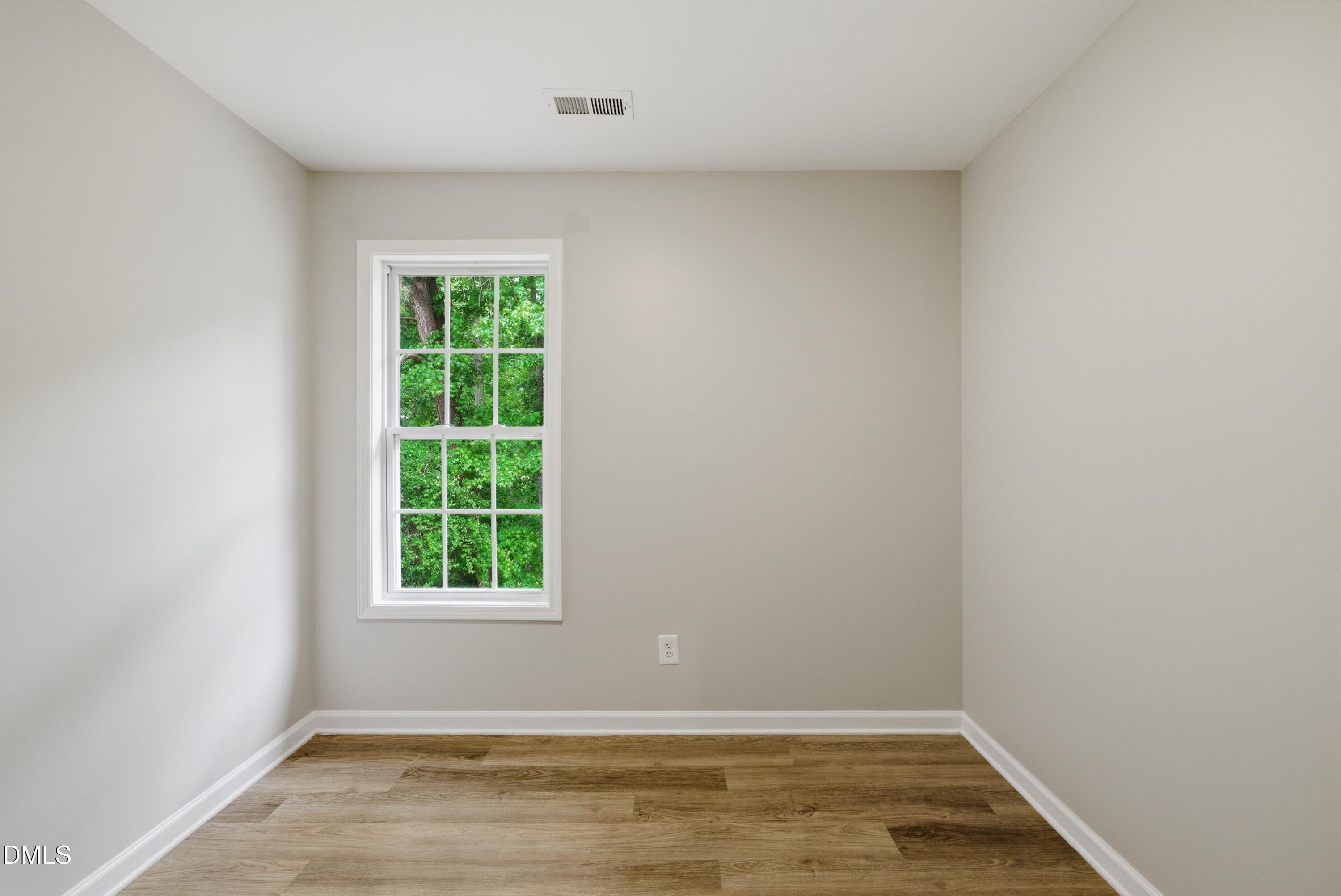 201 Tonylee Court, Unit A Raleigh, NC 27603 - Photo 28 of 30 an empty room with window