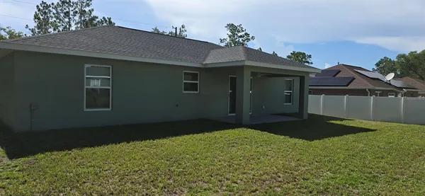 a backyard of a house with lots of green space