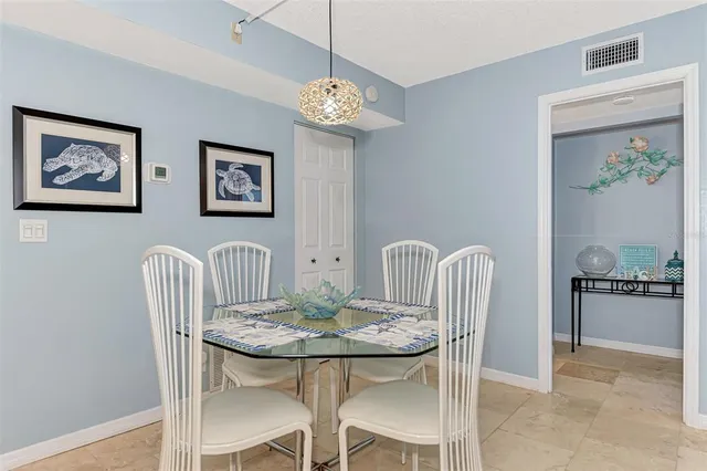 a view of a livingroom with furniture and a table