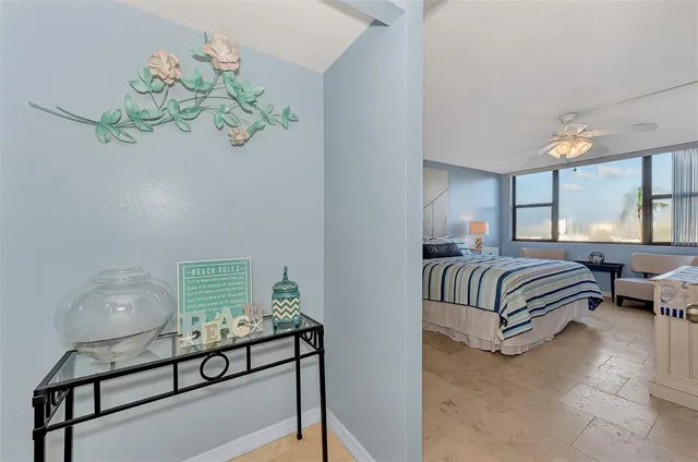 a bedroom with a bed and a tv