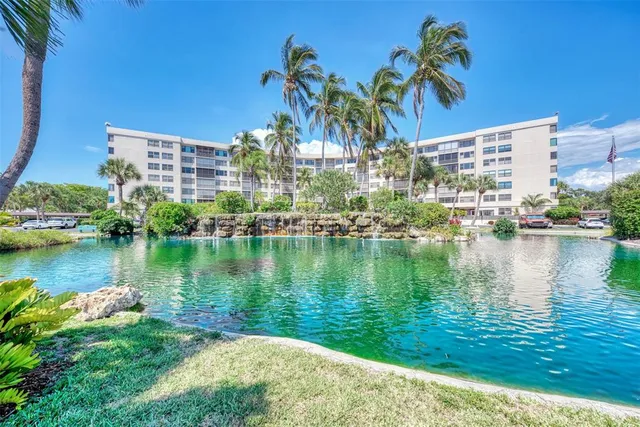 a living room with furniture and large windows