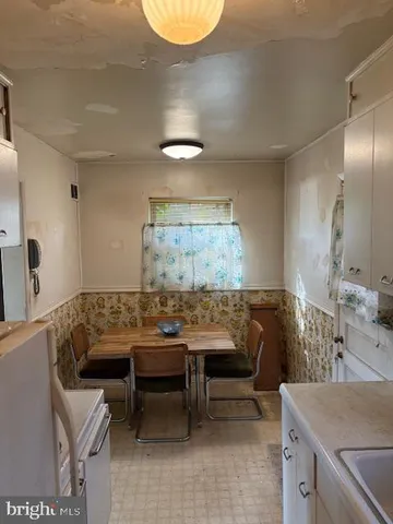 a view of a livingroom with furniture and window