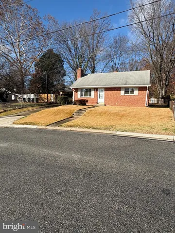a view of house with snow on the road