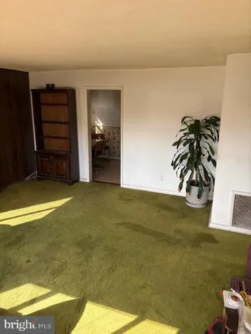 a view of a livingroom with furniture and natural light