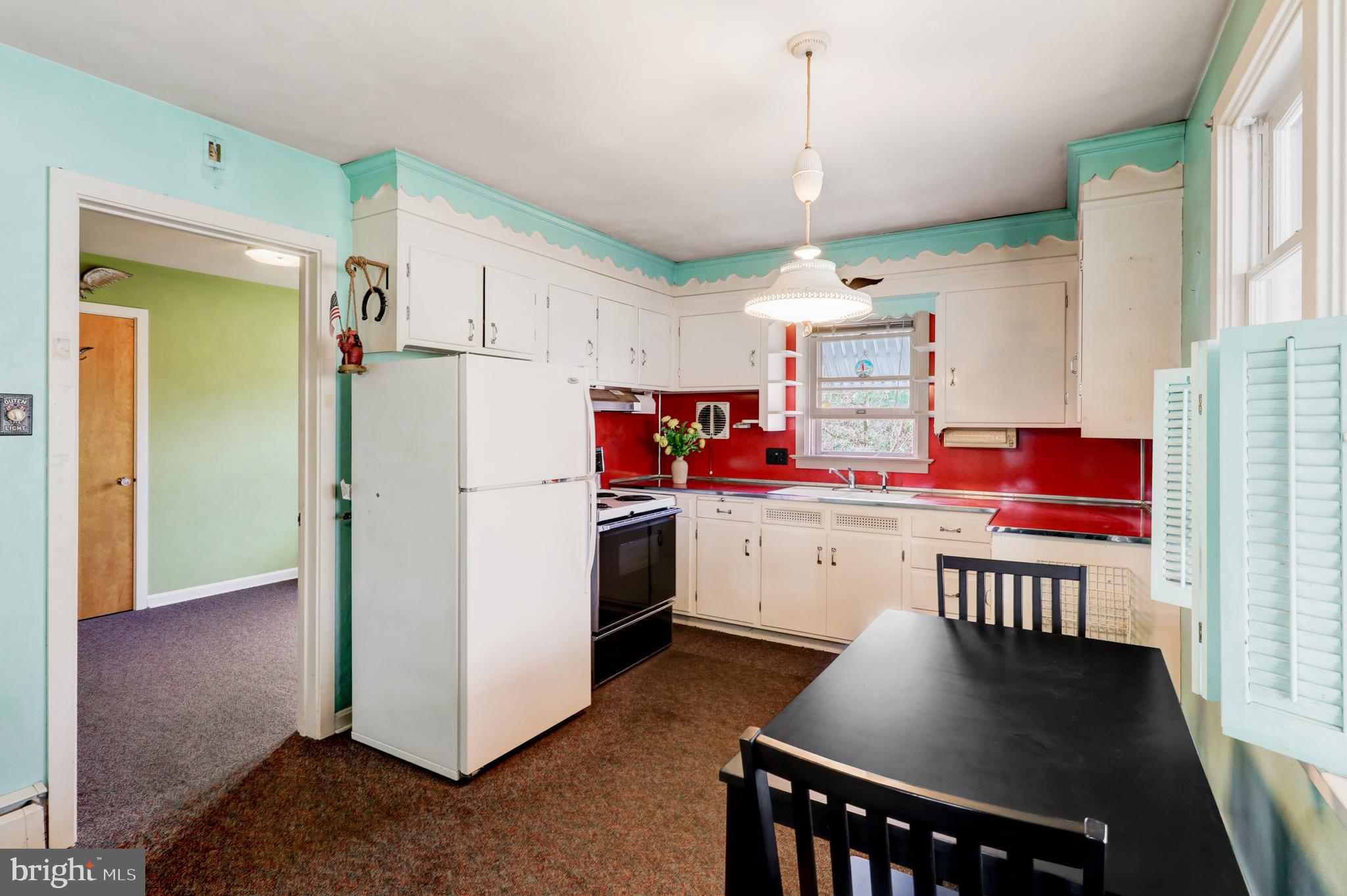 216 North Pitt Street Manheim, PA 17545 - Photo 11 of 30 a kitchen with refrigerator cabinets and wooden floor