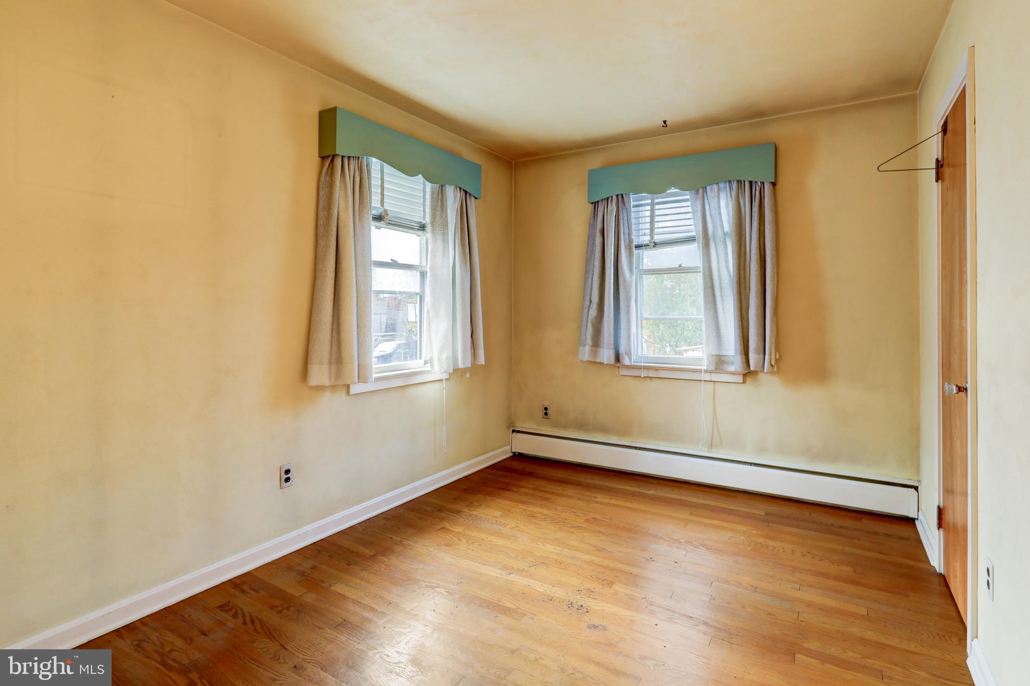 216 North Pitt Street Manheim, PA 17545 - Photo 16 of 30 an empty room with wooden floor and windows