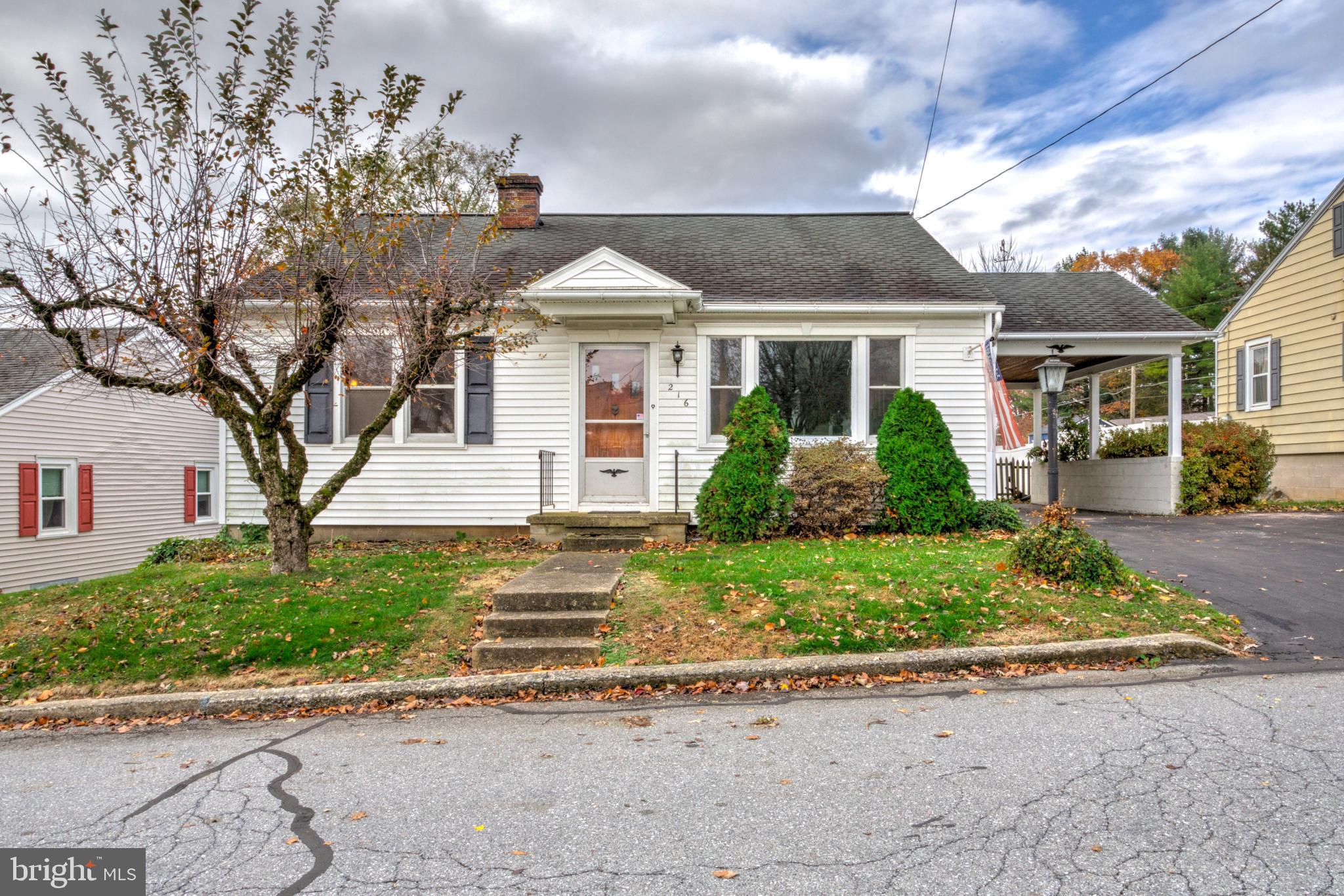 216 North Pitt Street Manheim, PA 17545 - Photo 2 of 30 a front view of a house with a yard and potted plants