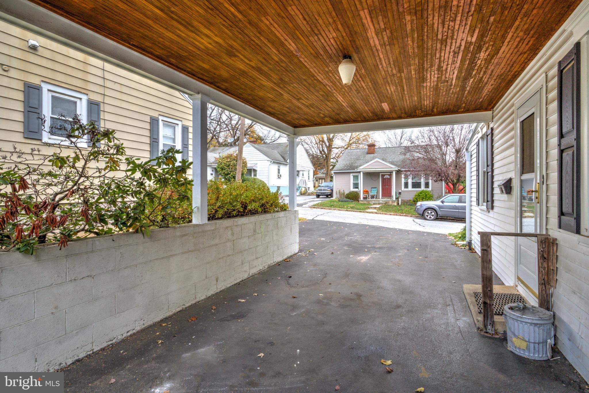 216 North Pitt Street Manheim, PA 17545 - Photo 25 of 30 a view of a porch with a table and chairs and potted plants
