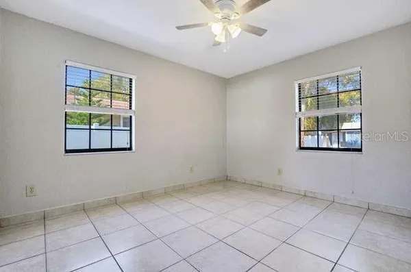 a view of an empty room with a window