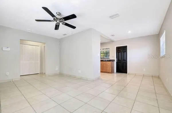a view of a kitchen with a sink and a stove top oven