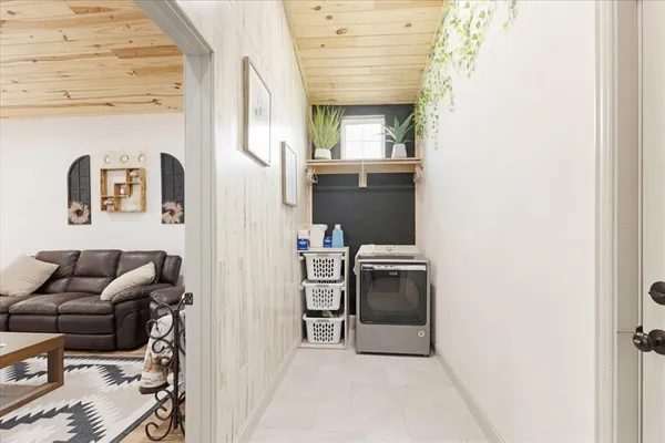 a view of livingroom with furniture and workspace