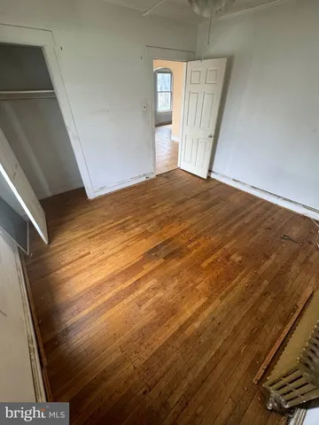 a view of an empty room with a fireplace