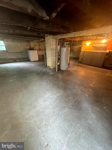 a view of a room with water heater and storage