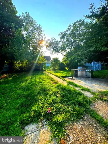 a backyard of a house with lots of green space