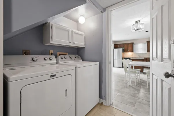 a bed room with furniture and a flat screen tv