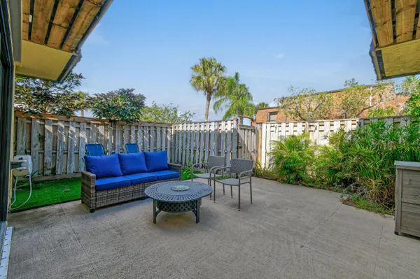 a house view with a sitting space and garden