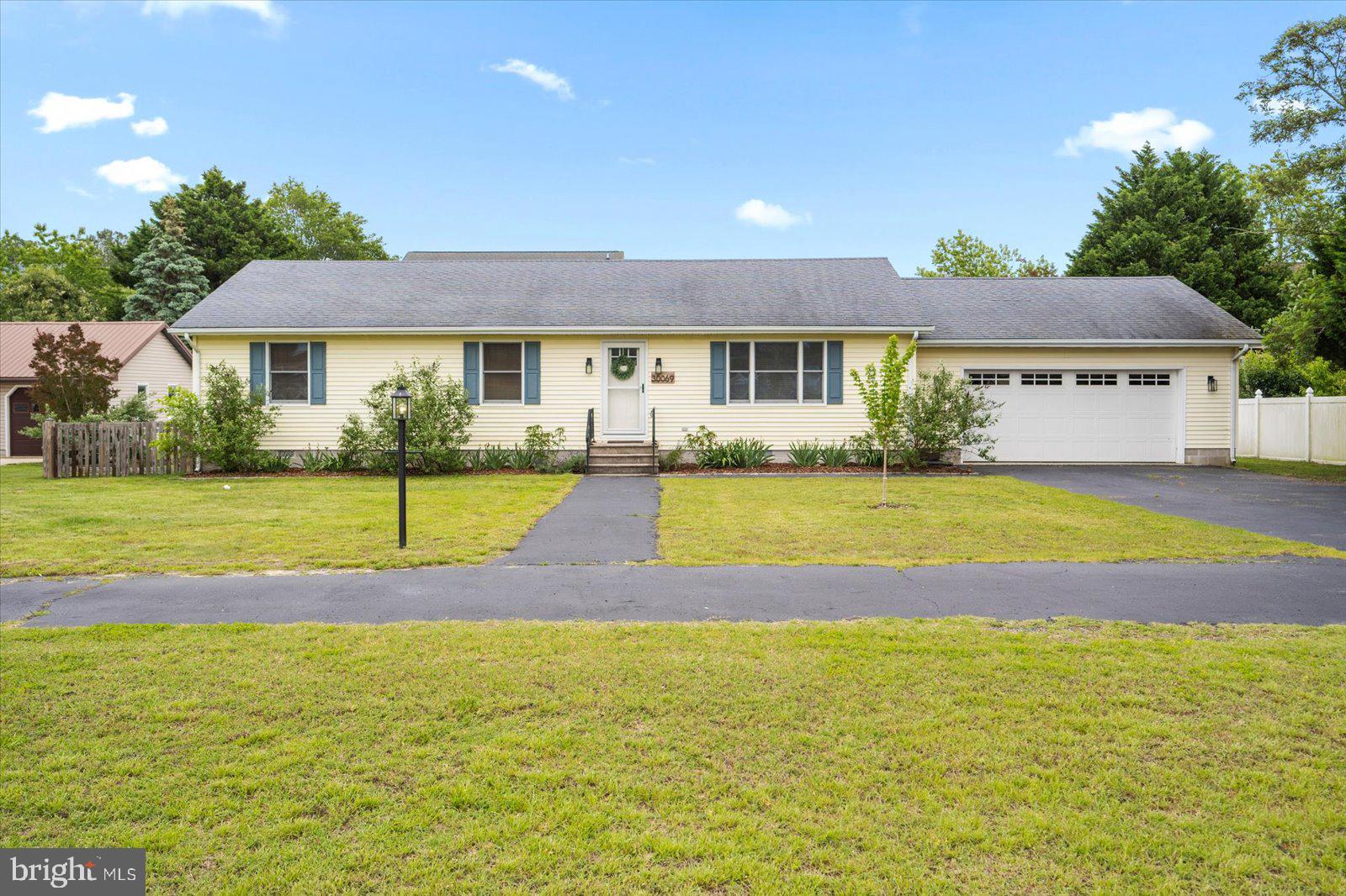 30069 Cedar Neck Road Ocean View, DE 19970 - Photo 1 of 61 a view of a house next to a big yard