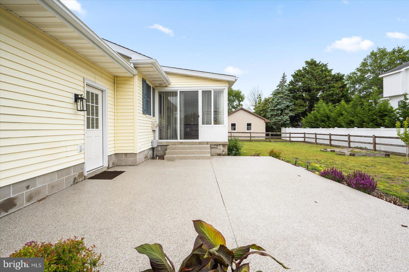 30069 Cedar Neck Road Ocean View, DE 19970 - Photo 32 of 61 a house view with a sitting space and garden space
