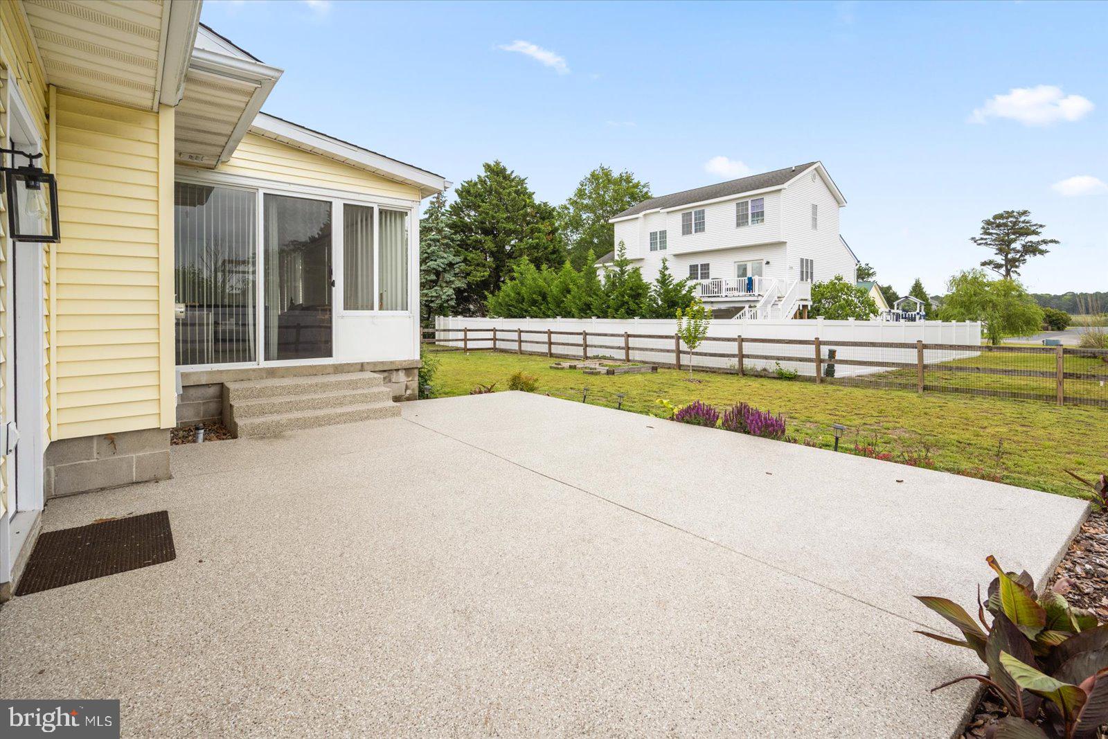 30069 Cedar Neck Road Ocean View, DE 19970 - Photo 33 of 61 a view of swimming pool with outdoor seating and a garden