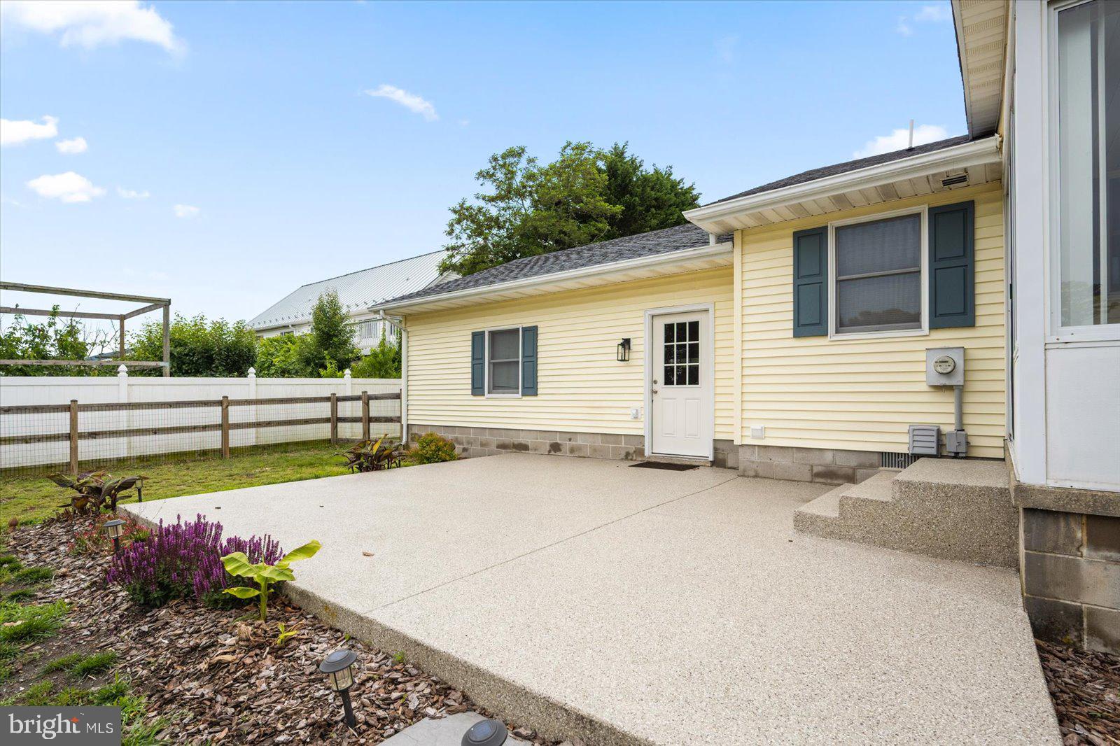 30069 Cedar Neck Road Ocean View, DE 19970 - Photo 36 of 61 a view of a backyard with plants and garden